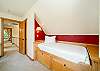 Twin bed in the King bedroom with private deck and  desk. 