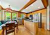 Open kitchen and dining area with fully equipped kitchen. 