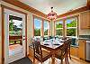 Dining area with bench seating and access to outside deck area.
