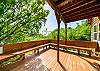 Large relaxing deck over natural wildlife preserve off of the open living area.