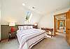 Upstairs bedroom with King and twin beds, private deck with ocean views, and desk for working. 