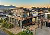 Large wrap around deck with fire table, Gas BBQ, deck furniture and spectacular views of the ocean and mountain. 