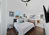Master bedroom with King bed, big screen TV, private bath and access to the ocean view deck.