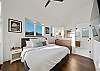Master bedroom with attached master bath and access to the deck. 