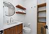 Hallway bathroom with steam shower