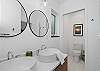 Master bath with double sinks, soaker tub, shower and toilet.