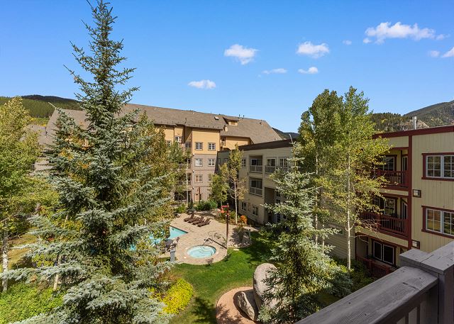 Private balcony with outdoor seating and pool views!