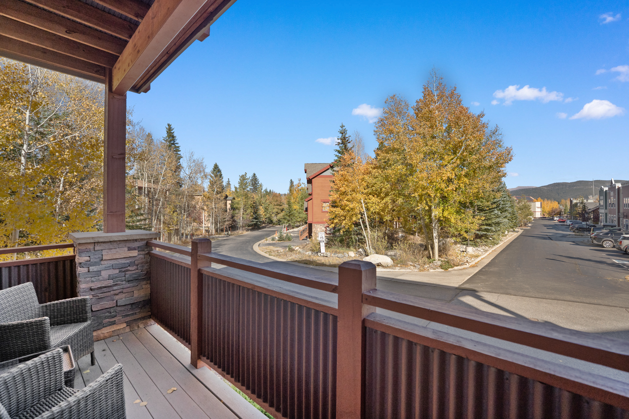 Private balcony with outdoor seating and mountain views. 