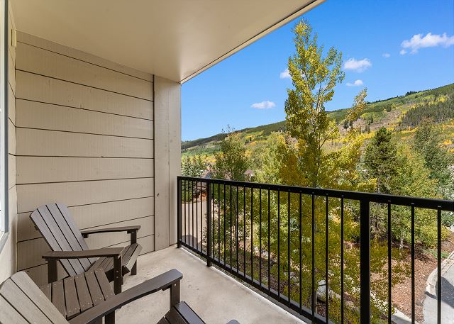 Private balcony with outdoor seating to soak in the mountain views!