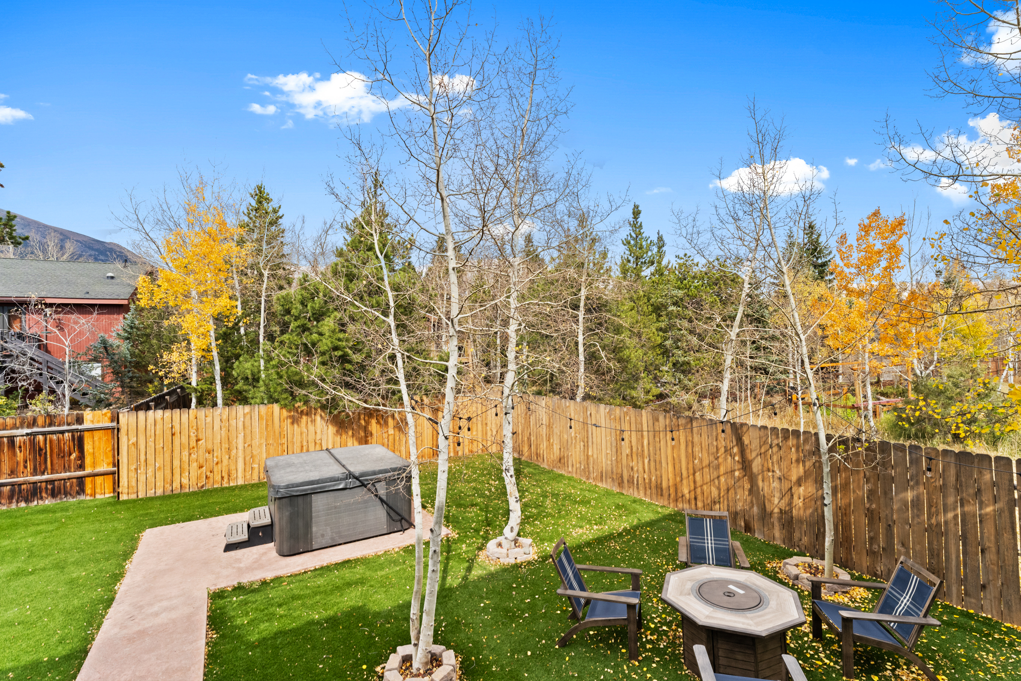 Spacious private backyard with gas fire-pit, private hot tub, and gas grill. 