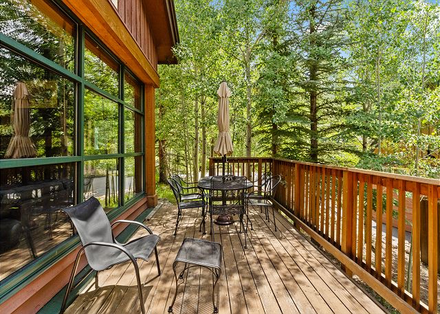 Private patio with outdoor seating and electric grill.