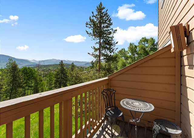 Main floor balcony with outdoor seating and beautiful mountain views!