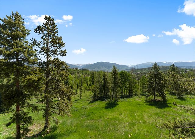 Main floor balcony with outdoor seating and beautiful mountain views!