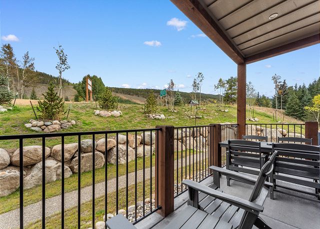 Private deck with outdoor seating and grill. 
