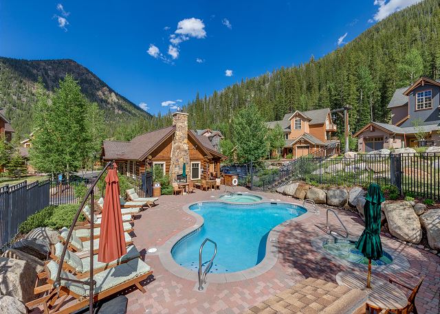 Clubhouse and outdoor pool and hot tub across the street with panoramic mountain views! 