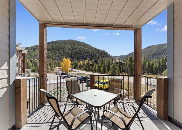 Private balcony with outdoor seating and gorgeous mountain views. 