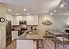 Kitchen has Large Slab Granite Bar
