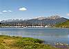 Shoreline View of Lake, Mountains, Marina