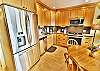 Kitchen with Slab Granite Counters and Stainless Appliances