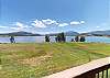 Deck View of Lake, Lawn, Mountains