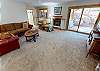 Downstairs Living Area. Gas fireplace is under repair and turned off.