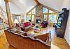 Main Floor Living Area with Flatscreen, Gas Fireplace, Large Windows