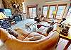 Living Room with Leather Sectional, Large Flatscreen, Wood Fireplace