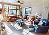 Living Area is Full of Light, has Leather Furniture