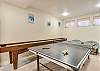 Downstairs game room shuffleboad and ping pong
