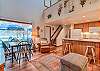 View of living room, dining area and upstairs