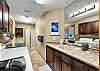 Laundry Room and Bathroom Downstairs with a walk in shower
