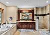 Primary Bedroom Bath. Large soaking tub, dual vanity custom tile work. 