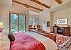 Bedroom #2 - Sitting area and private access to back yard with a river view