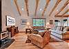 Upstairs Living Room area with Large Flat Screen TV and Wood stove