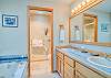 King Master Bathroom Dual Vanity and jacuzzi tub and walk in shower