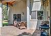 Patio with some seating and BBQ