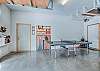 Garage with cornhole and pickle ball rackets