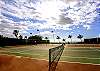 Full tennis courts and beach volleyball net keeps guests busy.