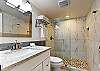 Newly renovated vanity with custom marble walk in shower