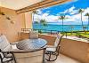 Step out to the lanai and take your seat at the table.