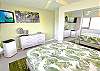 Bright, breezy room with soft tropical textures.

