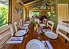 Enjoy a meal with the cool breeze of the wall unit AC or ceiling fan