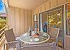Surrounded by lush greenery, this tranquil lanai is your personal slice of Hawaiian paradise.