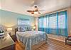 Relax in style in this charming bedroom designed with comfort and tropical elegance.