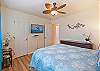 Drift off to sleep in this stylish bedroom while watching your favorite shows.