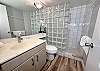 Freshen up for your next adventure in this large bathroom.