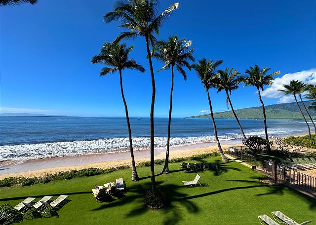 Private lanai overlooking the glittering Pacific and tropical grounds.