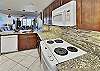 Stunning, updated kitchen complete with granite countertops, back splash and fully stocked