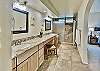 Spacious master bathroom with large, tiled shower and vanity!
