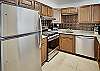 Enjoy a homecooked meal with everything you could need supplied in the condo kitchen.